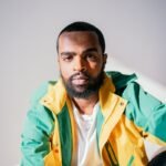 man in green and yellow zip up jacket